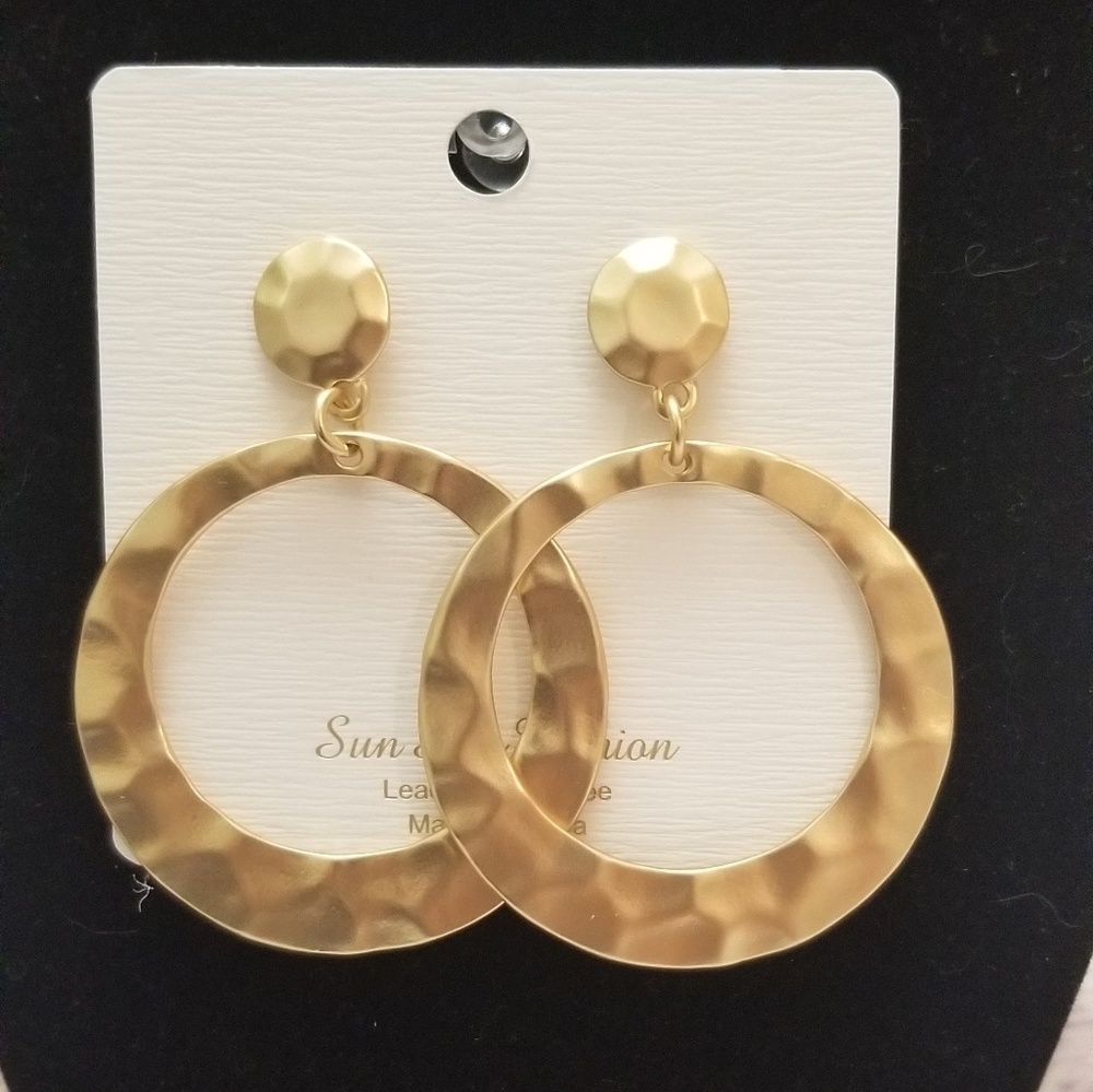 Matte gold dangle earrings.